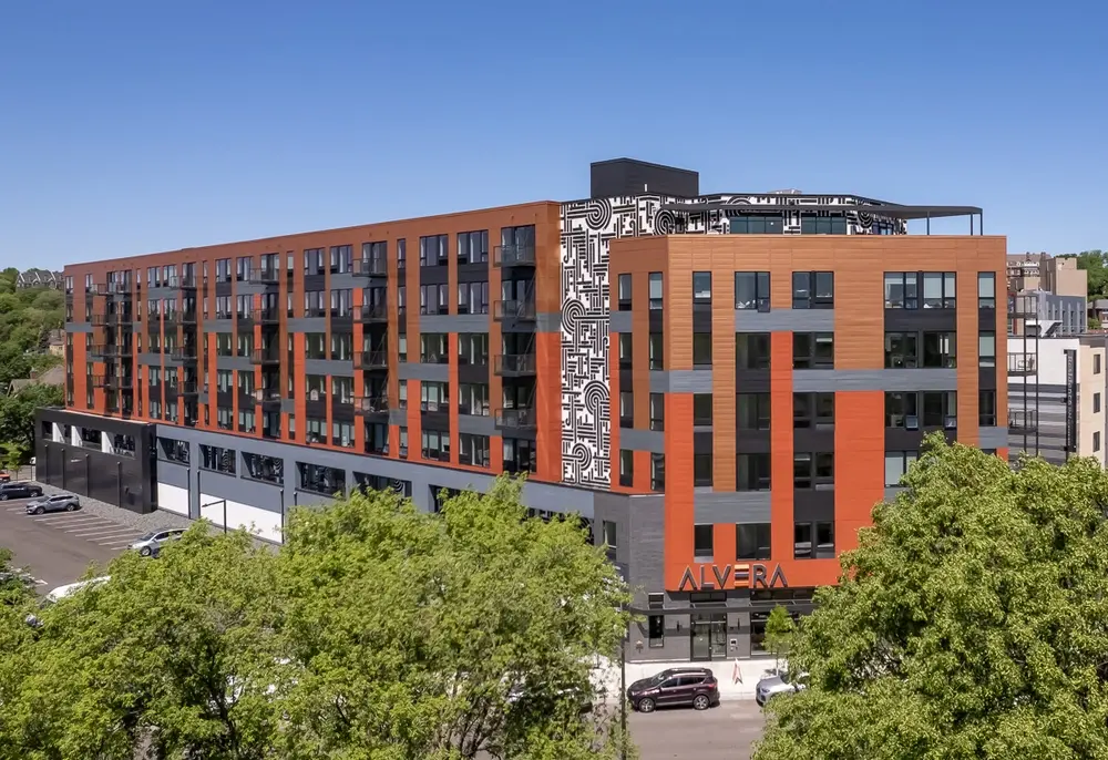 Apartment building with Dryvit orange and grey facade 