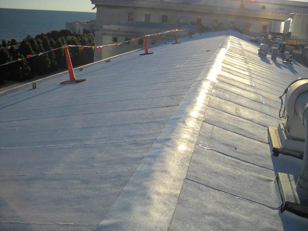 Recently finished roof restoration using Tremco roofing materials during sunset