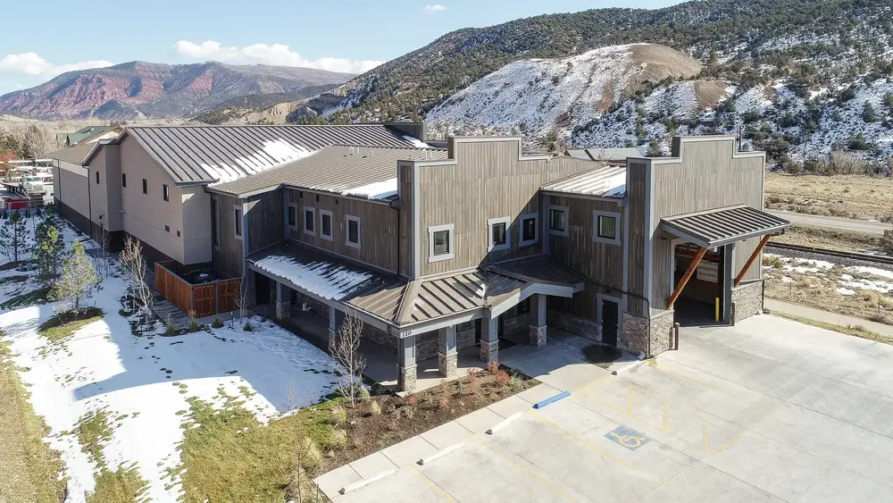 Building with Dryvit woodgrain exterior finish in mountains